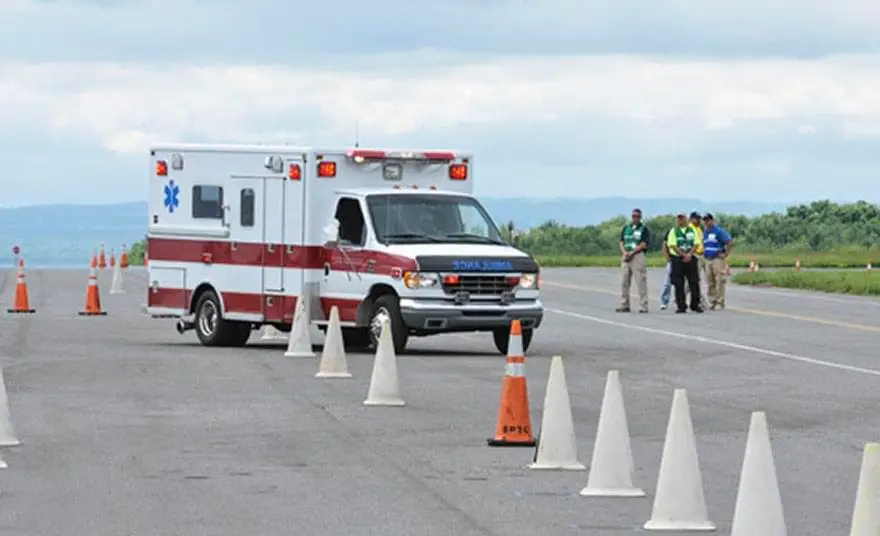 Ambulance navigating a defensive driving course during EVOC certification training in Florida