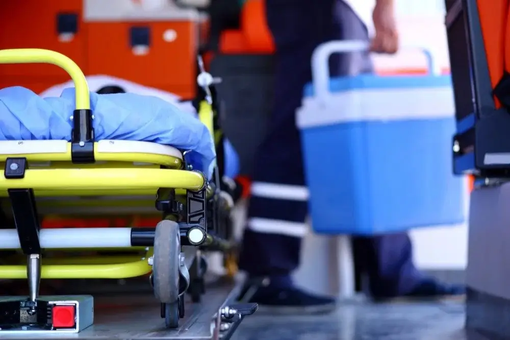 EMS stretcher and cooler for organ transport inside an ambulance, illustrating the role of EVOC training in medical logistics