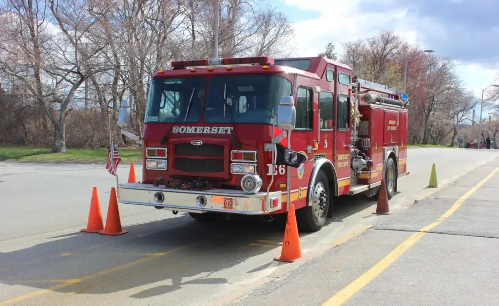 Fire engine participating in EVOC cone course training, demonstrating skills required for renewal and recertification of emergency vehicle operators.